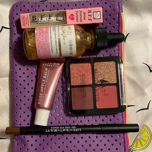 Purple ipsy bag with goodies